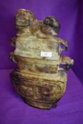 A large and imposing archaic styled Chinese soap stone lidded vessel having dragon head handles