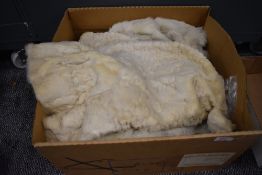 A box of vintage furs for make do and mend or repair including an ermine cape having Harrods label.