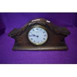 An oak cased mantle clock having 8 day movement