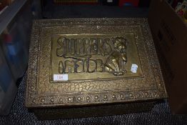 A vintage brass slipper box having embossed dog and Slipper Inside design