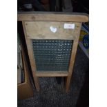 A vintage 1920's glass wash board