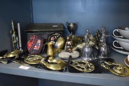 A selection of brass wares including horse brass, bells, figures and biscuit tin