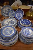 A selection of blue and white wear plates and saucers etc