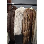 A selection of fur coats and a stole including fox