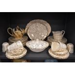 A part dinner and tea service by Washington Pottery, Hanley, in a cream ground a gilt design