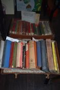 A small leather suitcase containing hard back books of various interest
