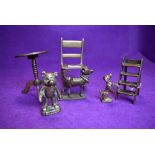 A selection of brass wares including miniature model chair
