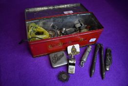 A selection of hardware including whistles pocket and pen knives and similar items