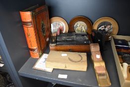 A selection of hardware including brass bodied plane, cut throat razors and book shaped biscuit