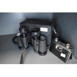 A pair of fold away pocket binoculars and a similar pair by Boots 8x30 with case