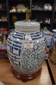A large hand decorated Chinese food jar having been later converted into lamp base