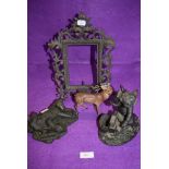 An ornate Victorian picture or photo frame in cast metal and three figures including deer