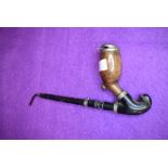 A Victorian opium smokers pipe having ebony shaft with a burr wood formed bowl