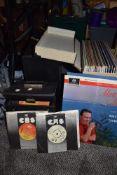 A selection of vinyl albums and 45rpm singles including carry cases