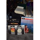 A selection of vinyl albums and 45rpm singles including carry cases