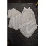 A collection of antique aprons and petticoats having cut and lace work