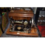 A 1920's English JONES FAMILY C.S. Type 7 Queen Alexandra Sewing Machine with wooden case