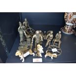 A selection of both metal cast and ceramic figures including small dogs