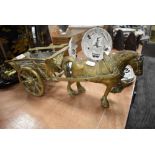 A brass cast figure of a horse and cart