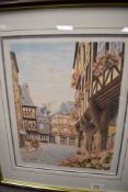 A full colour print of a Tudor style town scene