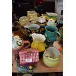 A selection of various ceramic water jugs including art deco designs and Grays pottery