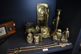 A selection of brass wares including figures, pair of candle sticks, fold out ashtray and incense