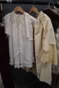 An antique wool christening shawl or similar,a tulle babies gown and more.