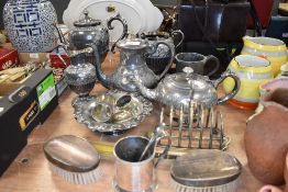 A selection of plated wares including Victorian part tea set and dress brushes