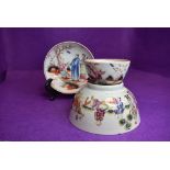 A New Hall tea bowl and saucer depicting scenes of child catchi
