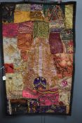 A vintage panel or sampler using panels of various fabrics with embroidery,sequins, braid work and