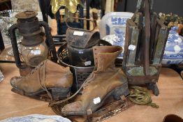 A selection of vintage hardware including Barton Lamp, ladies ice skates, and farm house fruit