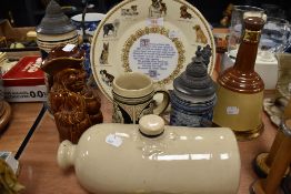 A selection of ceramics including German beer steins and ceramic foot warmer