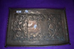 An arts and crafts hand worked copper tray having embossed Mackintosh style design