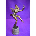 An art deco dancing figure sculpture metal cast on marble style base with a gilt finish marked