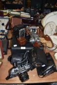 A selection of cameras and photography equipment including Canon AE-1 and Chinon CE-4