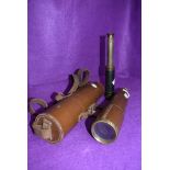 A four drawer brass cased telescope by Brittanic BC and Co having fitted leather case and a