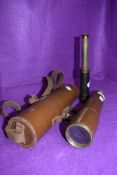 A four drawer brass cased telescope by Brittanic BC and Co having fitted leather case and a