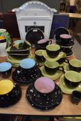 A selection of un marked tea cups and saucers including polka dot and two tone