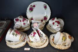 A part tea service by Colclough having various floral designs twelve tea cup and saucer sets plus