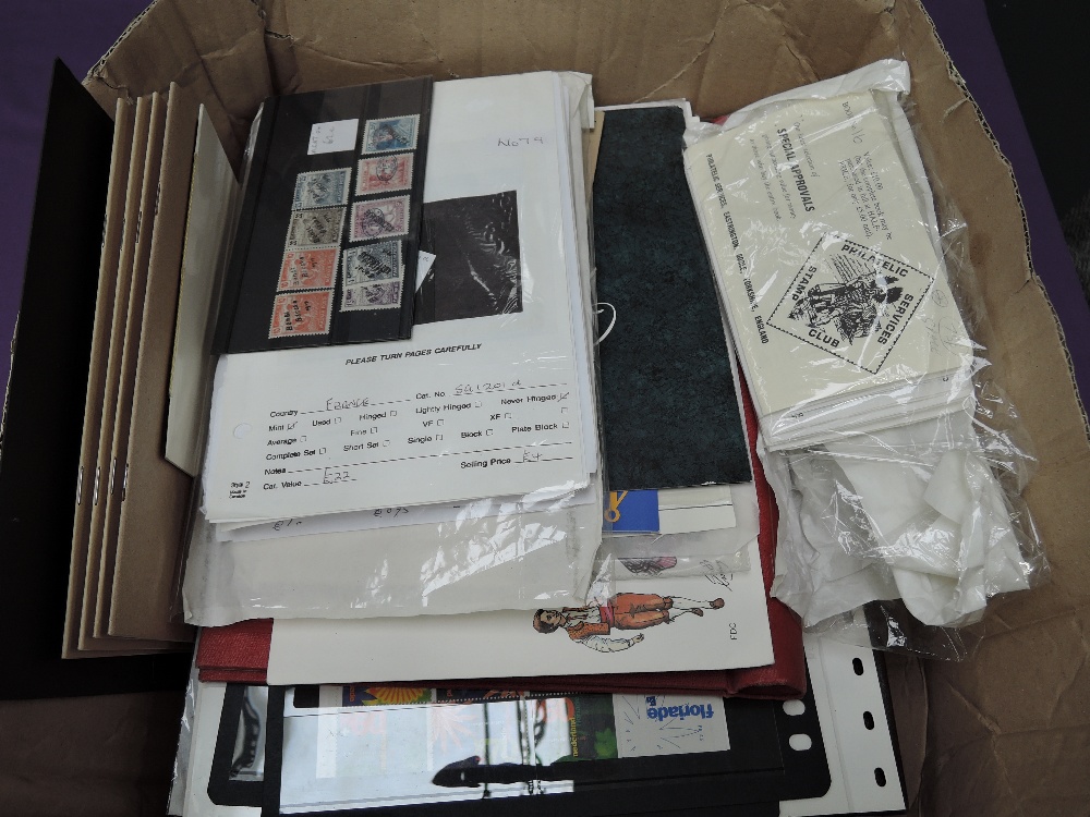 A box of World Stamps, in albums, on cards and loose, mint and used