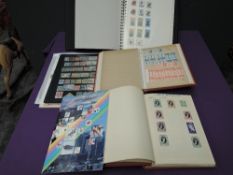 A collection of Commonwealth and World Stamps, in albums and on cards, mint and used