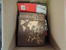 A box of GB and World Stamps, loose, in stock books and albums along with a small collection of