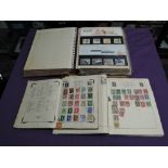 An album of mainly GB Presentation Packs along with two World Stamp Albums