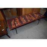 A vintage coffee table in the Piper style, having Greco-Romanesque decoration, approx. 115 x 38cm