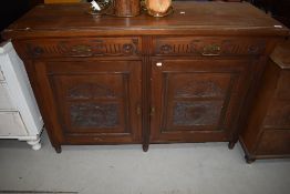 A late 19th Century mahogany sideboard base, having Aesthetic style brass handles, width approx.