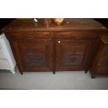 A late 19th Century mahogany sideboard base, having Aesthetic style brass handles, width approx.