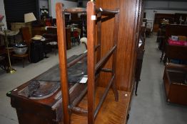 A Victorian mahogany towel rail having part turned frame