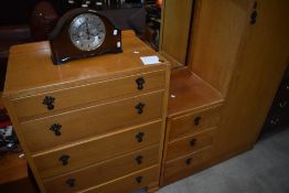 An early to mid 20th Century golden oak and ply two piece bedroom suite comprising single robe