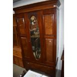 A Victorian mahogany three piece bedroom suit comprising mirror door wardrobe, dressing table and