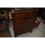 An early 20th Century mahogany chest of drawers, with rails and mirror to convert back to dressing